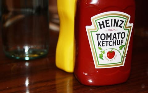 A bottle of Heinz Tomato Ketchup on a table