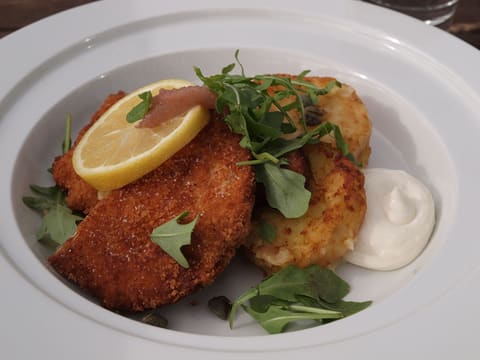 Breaded veal cutlet (Wiener Schnitzel) on a plate