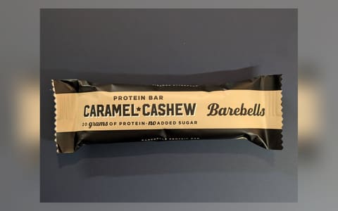 A Barebells Caramel Cashew protein bar in its wrapper