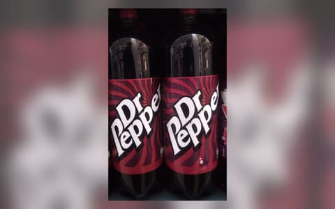 Two 2-litre bottles of Dr Pepper on a UK supermarket shelf