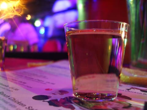 Clear spirit poured in a glass (product-neutral)