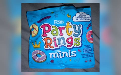 A bag of Fox's Party Rings minis with iced rings drawn on the front