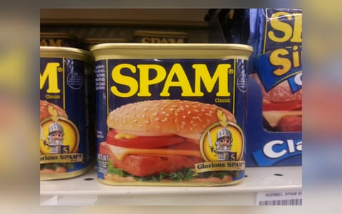 A can of SPAM Classic on a supermarket shelf