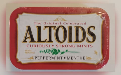 A sealed 50 g tin of Altoids Peppermint curiously strong mints