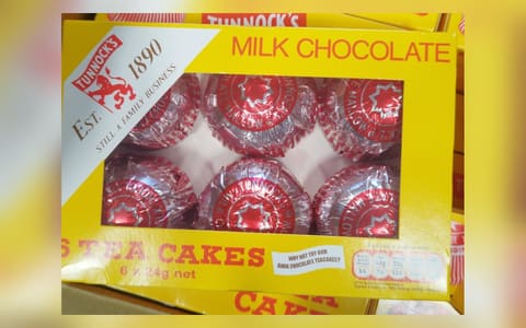 A box of six Tunnock's milk chocolate Teacakes in their red and silver foil
