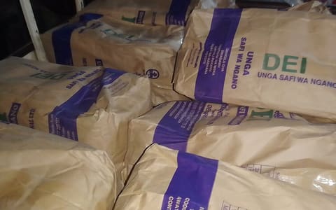 Stacked paper bags of wheat flour labelled Unga safi wa ngano (Swahili for pure wheat flour)