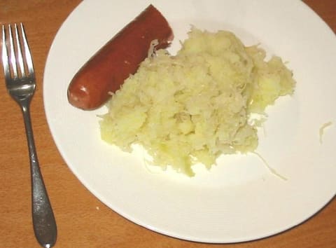 Sauerkraut with sausage on a plate