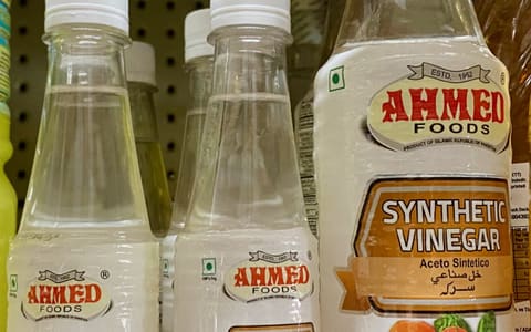 Bottles of synthetic vinegar, a dilute solution of acetic acid (E260)