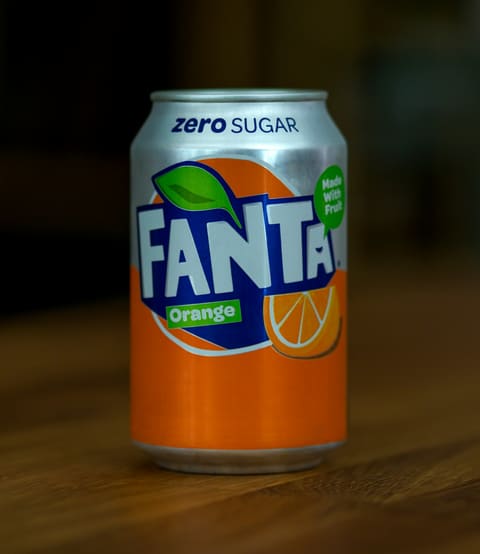 Orange soda in a glass (product-neutral)