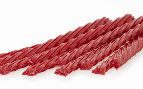 A pile of red Twizzlers twists