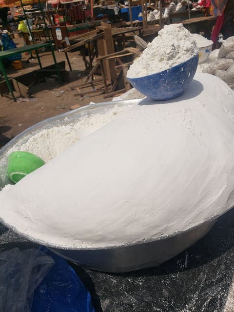 Bulk white corn flour / cornstarch powder in a market bowl