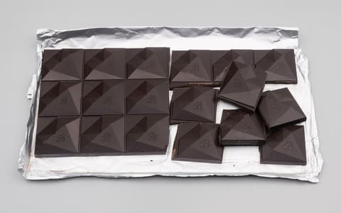 A bar of dark chocolate broken into squares (not a Lindt product)