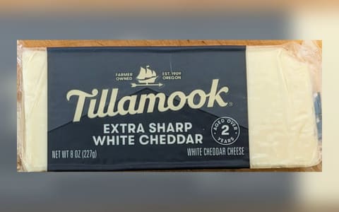 An 8 oz block of Tillamook Extra Sharp White Cheddar, aged over 2 years