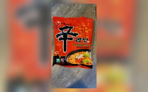 A Nongshim Shin Ramyun noodle soup pack with a Halal logo and 'Made in Korea' on the front