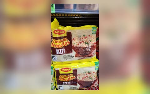 Packs of Maggi 2 Minute Noodles Beef Flavour on an Australian shop shelf